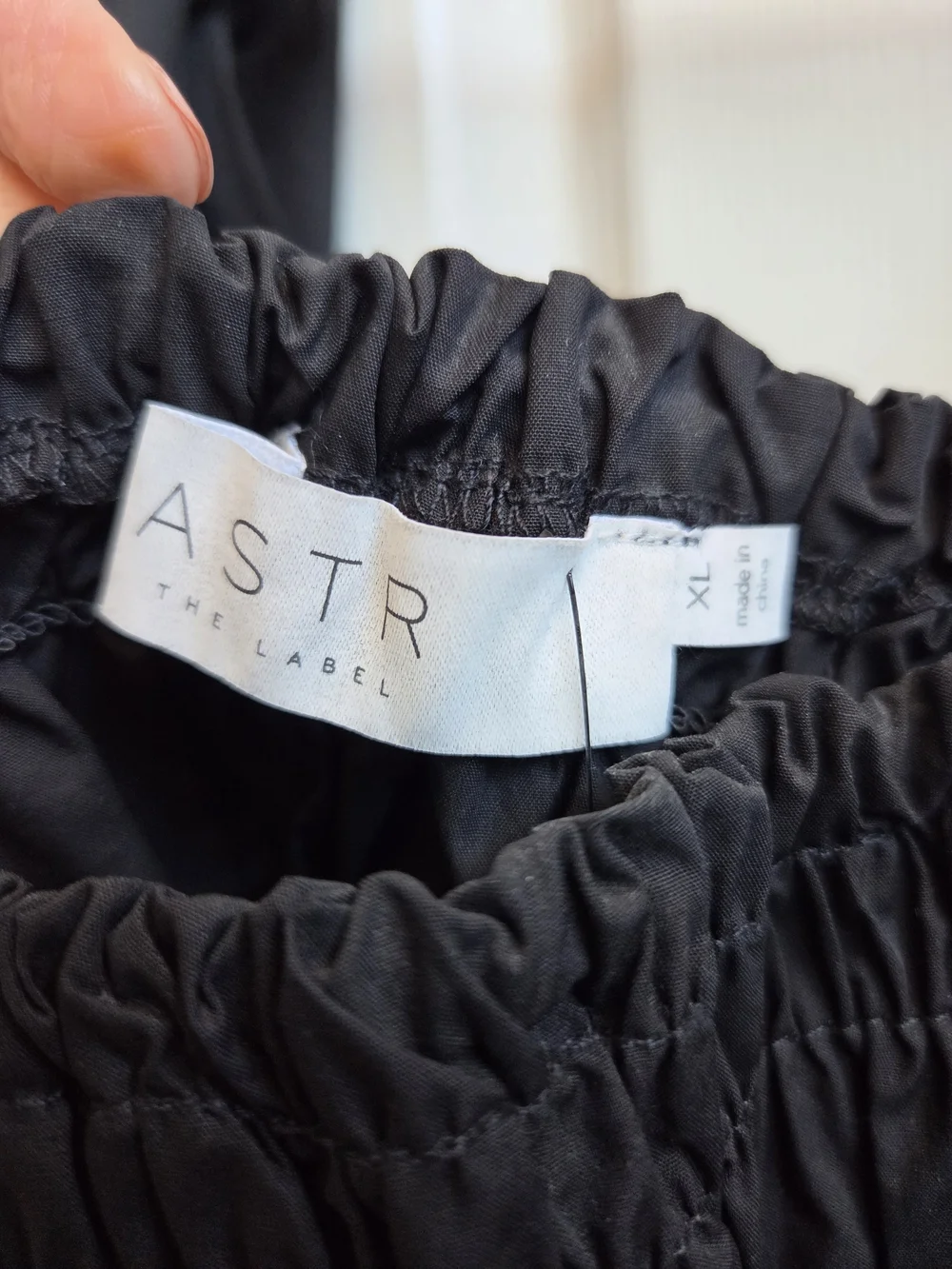 NWOT-Astr Black Smocked Peplum Blouse with Puff Sleeves